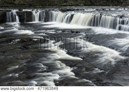 Beautiful Peaceful Landscape Image Of Aysgarth Falls In Yorkshire Dales In England During Winter Mor