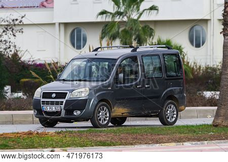 Side , Turkey -  January  27, 2023:   Silver Fiat Doblo Driving In The City