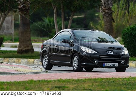 Side, Turkey -january 27, 2023:    Silver Peugeot 307  Cc  Is  Driving   On The Street On A Warm Sum