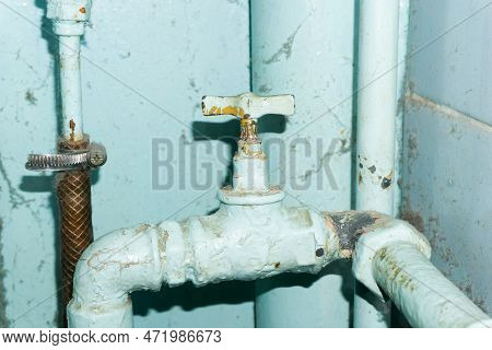 Dirty Water Pipe. Old Pipeline Construction. Rusty Plumbing System. House Renovation Background. Old