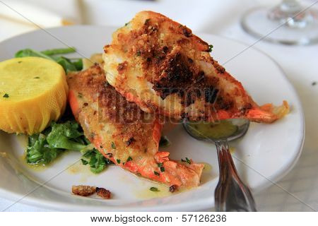 Fresh baked shrimp oreganata with lemon in netting
