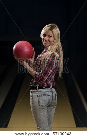 Women Holding A Bowling Ball