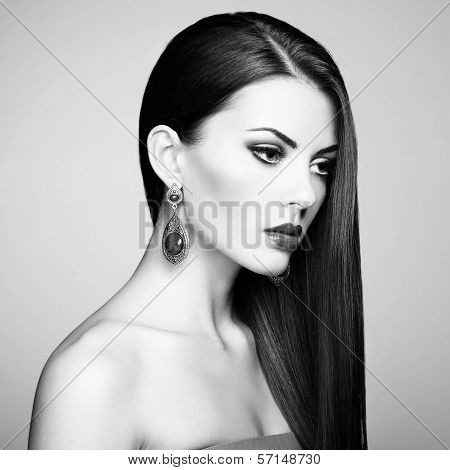 Portrait Of Beautiful Brunette Woman With Earring. Perfect Makeup