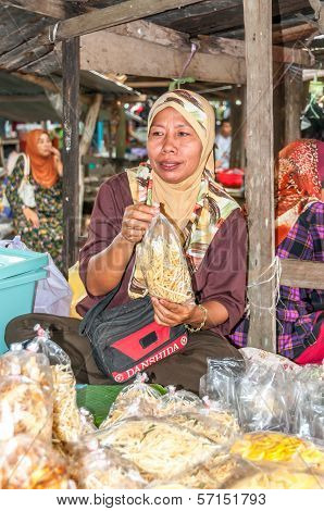 Woman Selling At Market