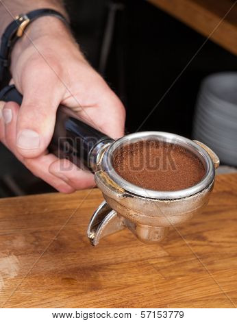 Tamping the coffee