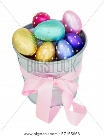 multicolored easter eggs in metal  pot
