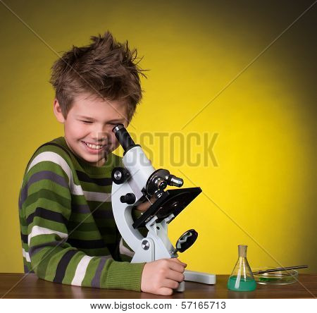 The boy with a microscope. Education.