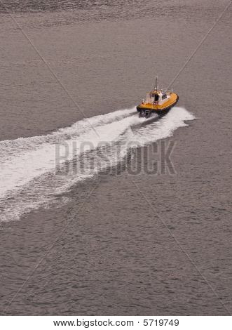 Yellow And Black Pilot Boat Speeding Away