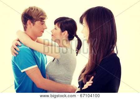 Sad brunette girl jealousy about her friend.