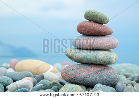 stack of stones on the beach and sea background