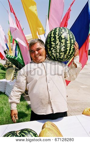 Ashgabat, Turkmenistan - August 26.  Portrait Of  Unidentified Laughing Asian Man With A Large Water