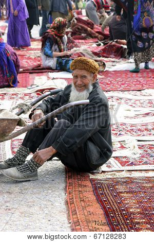Ashgabat, Turkmenistan - February 26.  Portrait Of Laughing Turkmen Man In Telpek With Bushy Beard.