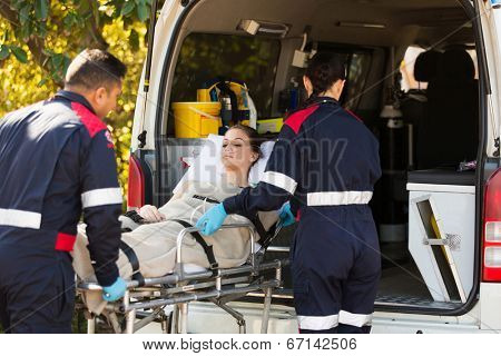 paramedic transporting patient to hospital with ambulance