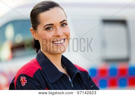 pretty young female paramedic looking at the camera