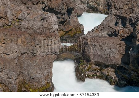Barnafoss is a dangerous Icelandic waterfall in the west of the island. It is formed by Hvita river going through a narrow canyon. 