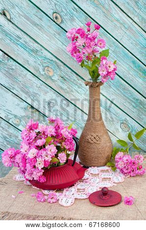 still life bouquet with roses and tea pot