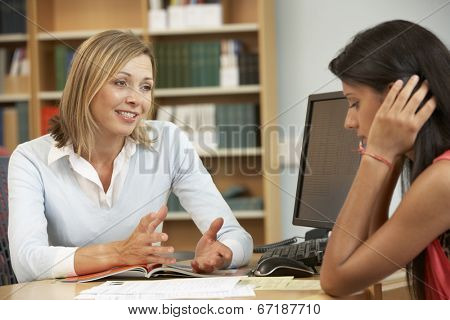 College tutor with student