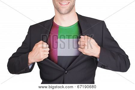 Businessman Opening Suit To Reveal Shirt With Flag