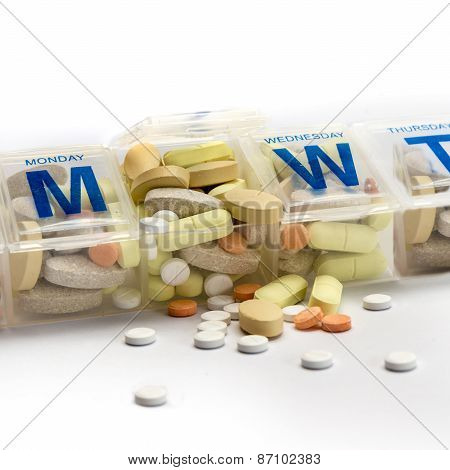 Pills Spill Out Of A Dossette Box