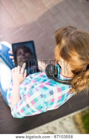 Beautiful young woman student with note pad. Outdoor student.