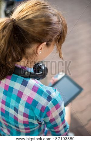 Beautiful young woman student with note pad. Outdoor student.