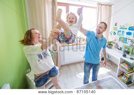 Young Attractive Parents and Child Portrait indoors