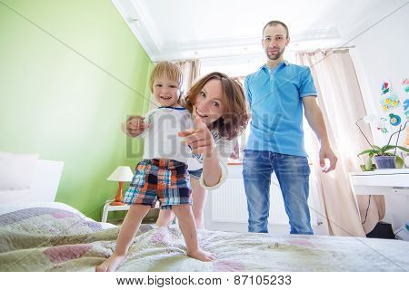 Young Attractive Parents and Child Portrait indoors