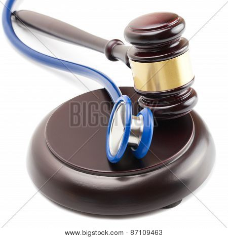 Judge Gavel And Stethoscope Next To It
