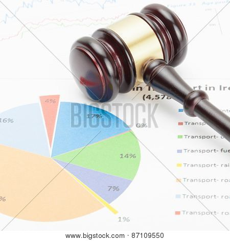 Wooden Judge's Gavel Over Colorful Diagram