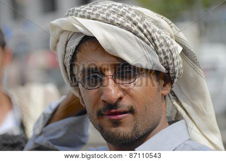 Portrait of unidentified man wearing traditional head scarf in Taizz, Yemen.