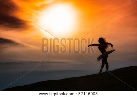 Ballerina Silhouette, Dancing Alone In Nature In The Mountains At Sunset
