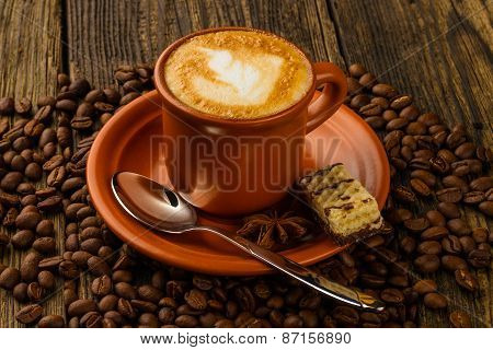 Cup Of Cappuccino, Milk-chocolate Wafer And Coffee Beans