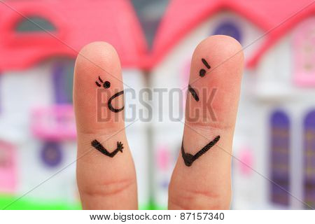 Finger art of a couple during quarrel. A woman yells at a man.