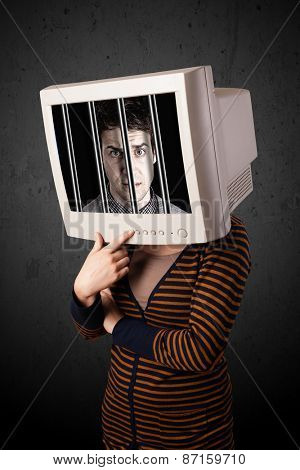Business man with monitor screen on his head traped into a digital system concept