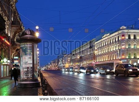 ST. PETERSBURG, RUSSIA - JANUARY 17, 2013: People and car traffic on the Nevsky Prospect in a winter morning. It is the main avenue of the city and one of the best-known streets in Russia