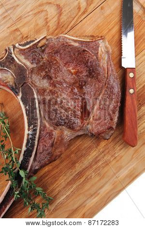 meat food : grilled beef spare rib on wooden plate with thyme