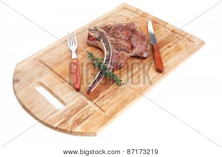 savory : grilled spare rib on wooden plate with thyme isolated over white background
