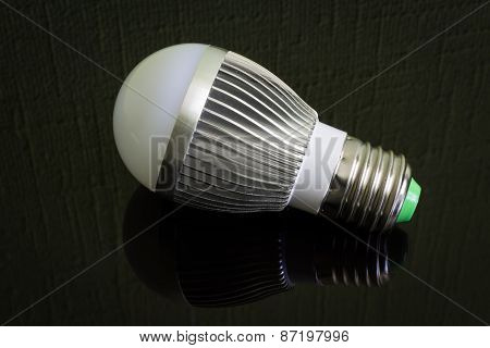 Close up Led Lamp on the black reflecting surface.