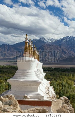 Buddhist Chortens (stupa) And Himalayas Mountains In The Background Near Shey Palace In Ladakh, Indi