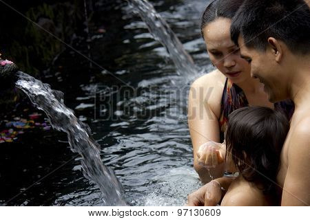Family Bathing At Sacred Fountains