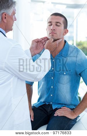 Doctor examining his patients ganglion in medical office