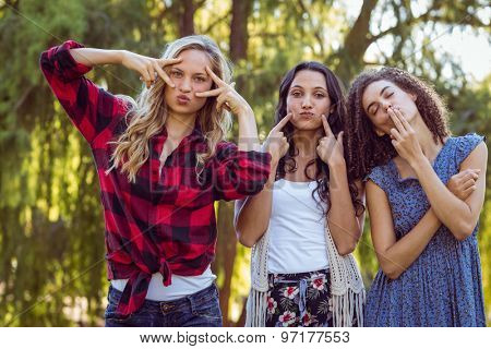 Happy hipsters in the park on a sunny day