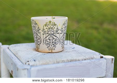 Decorative rusty pot without plant outdoor. Concept of garden decor.