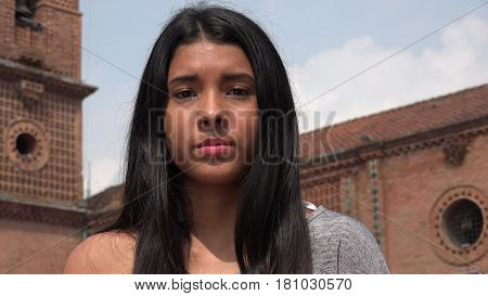 Serious Unemotional Teen Girl with Colombian Ethnicity
