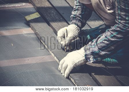 Carpenter Hand Or Hand Of Worker Marking On Wood Plate With Carpenter Pencil Marker In Work Shop.