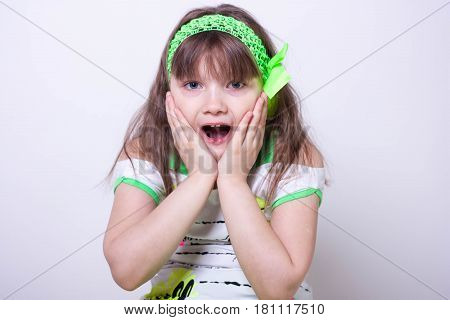 Little beautiful girl on a white background
