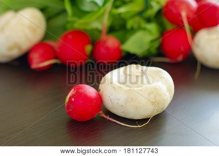 Radish with champignion healthy raw food. Organic vegetarian meal ingredients. Fresh salad vitamin vegan eating.