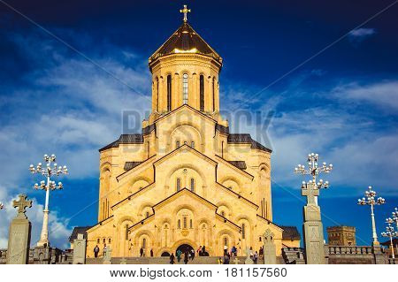 Famous Holy Trinity Cathedral Tsminda Sameba in Tbilisi, Georgia. Georgian Orthodox Church. Welcome To Georgia. Tourist attraction. Religious background. Travel concept. Caucasus region. Blue sky