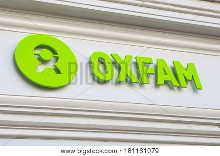 CUMBRIA UK - APRIL 4TH 2017: The Oxfam logo above a Shopfront on one of their charity shops in Cumbria UK on 4th April 2017.