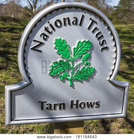 CUMBRIA UK - APRIL 8TH 2017: The sign for the beautiful Tarn Hows in the Lake District in Cumbria UK on 8th April 2017.